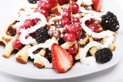 Delicious waffles and fresh berries Stock Photos