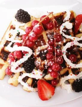Delicious waffles and fresh berries Stock Photos