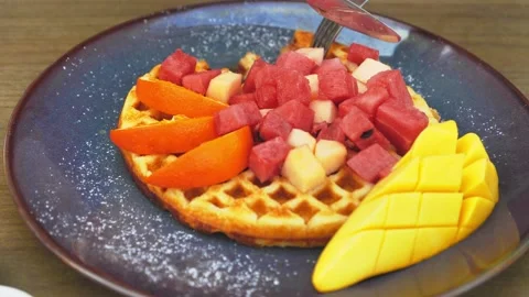 Delicious Waffles with a piece of fruit Stock Footage 171019066