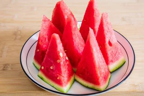Delicious watermelon slices on the table. Stock Photos
