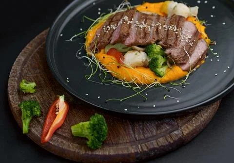 A deliciously appetizing pumpkin puree with chunks of beef meat with spices.. Stock Photos