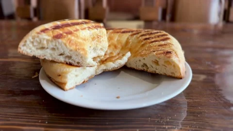 A Deliciously Freshly Baked Flatbread Featuring Eye Catching Grilled Patterns on Stock Footage 316402509
