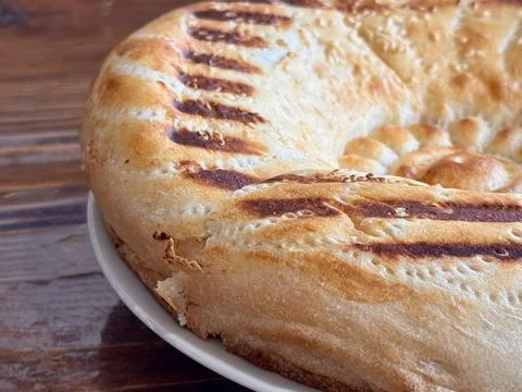 A Deliciously Freshly Baked Flatbread Featuring EyeCatching Grilled Patterns on Stock Photos