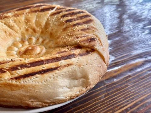 A Deliciously Freshly Baked Flatbread Featuring EyeCatching Grilled Patterns on 스톡 사진