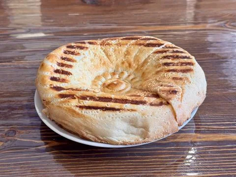 A Deliciously Freshly Baked Flatbread Featuring EyeCatching Grilled Patterns on 스톡 사진