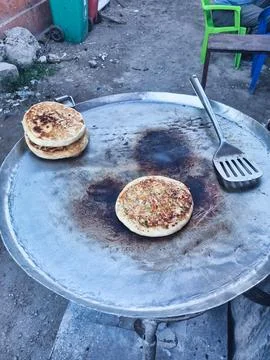Deliciously Freshly Cooked Flatbreads Being Made and Served on a Griddle Hot and Stock Photos