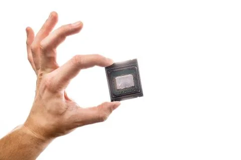 Delidded CPU with old thermal paste and glue in man's hand isolated on white Stock Photos