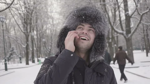 Delight happy handsome man calling friends to wish Merry Christmas Stock Footage 85595407