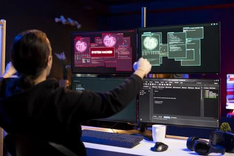 Delighted hacker celebrating after launching phishing attacks tricking users Stock Photos