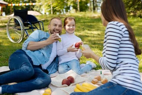 Delighted invalid man spending time on the picnic 스톡 사진