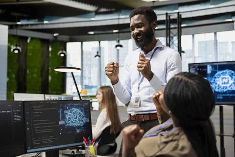 Delighted manager overseeing AI project in office happy with progress Foto stock