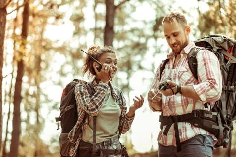 Delighted nice couple using their portable radio Foto stock