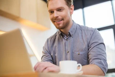 Delighted nice man smiling Stock-Fotos