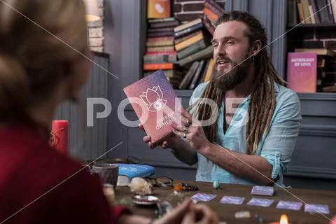 Delighted nice man speaking about the energy of health Stock Photos