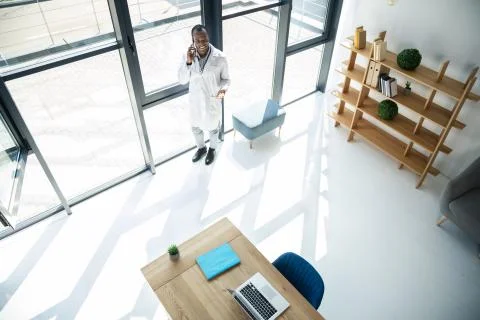 Delighted practitioner having pleasant talk Stock Photos