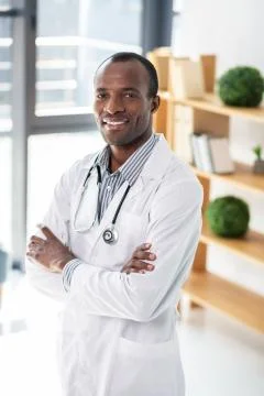 Delighted practitioner waiting for visitors Stock Photos