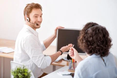 Delighted smiling colleagues working in the office Stock Photos
