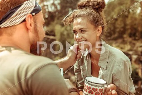 Delighted young woman smiling to her boyfriend Stock Photos