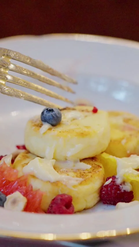 A Delightful and Delicious Pancake Stack Topped with Fresh Seasonal Fruits and Stock Footage 308662766