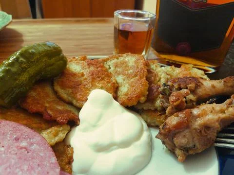 A delightful array of crispy potato pancakes, accompanied by succulent meat, Photos