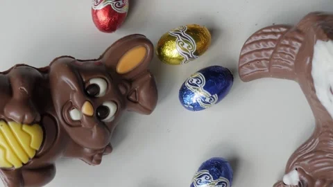 Delightful Easter Chocolate Bunny and Vibrant Eggs on Display Stock Footage 331910627