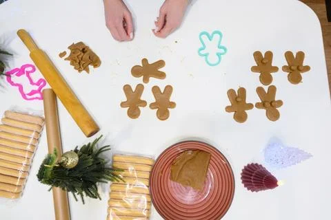 Delightful gingerbread cookie preparations fill the kitchen with festive cheer Stock Photos