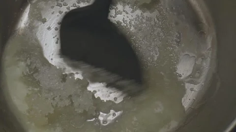 In a delightful miniature kitchen tiny cookware is used to create a sweet dish Video stock 286900454