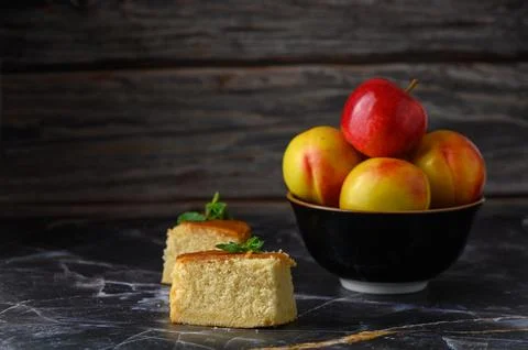Delightful rustic setting with fresh apples and homemade cake on a marble tab Stock Photos