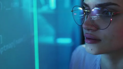 Delightful woman, programmer, software developer looking on digital screen with Stock Footage 245346158