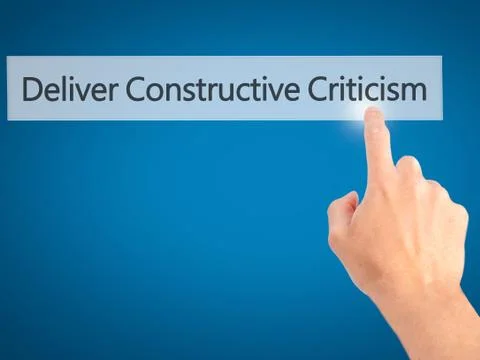 Deliver Constructive Criticism - Hand pressing a button on blurred background Stock Photos