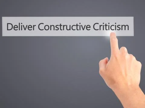 Deliver Constructive Criticism - Hand pressing a button on blurred background Stock Photos