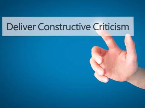 Deliver Constructive Criticism - Hand pressing a button on blurred background Foto stock