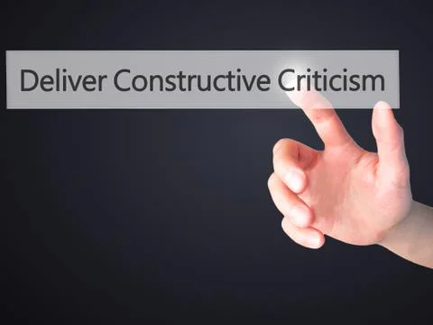 Deliver Constructive Criticism - Hand pressing a button on blurred background Stock Photos