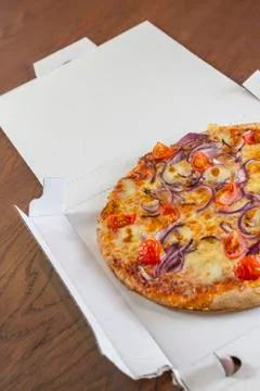 Delivered pizza in box Stock Photos