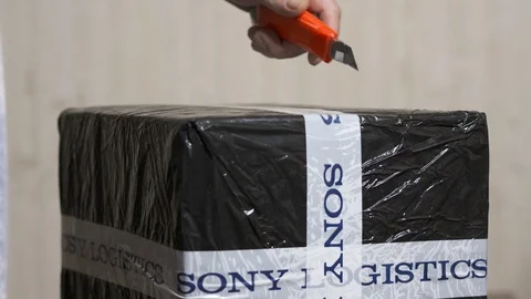 Delivered Sony electronics parcel package. Unboxing cardboard parcel Stock Footage 100588457