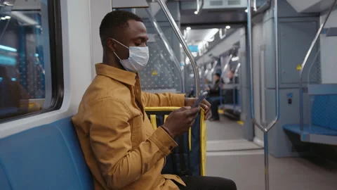 Deliverer spends time on the phone. Face mask, delivery during a pandemic Stock Footage 279731005