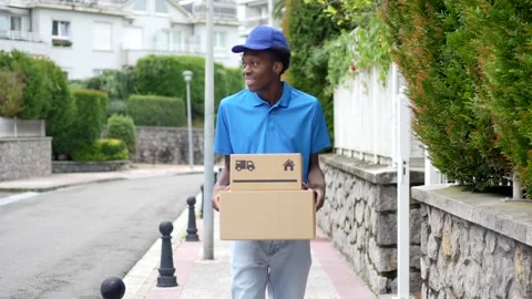 Delivery african man with parcel on hands Stock Footage 284419781