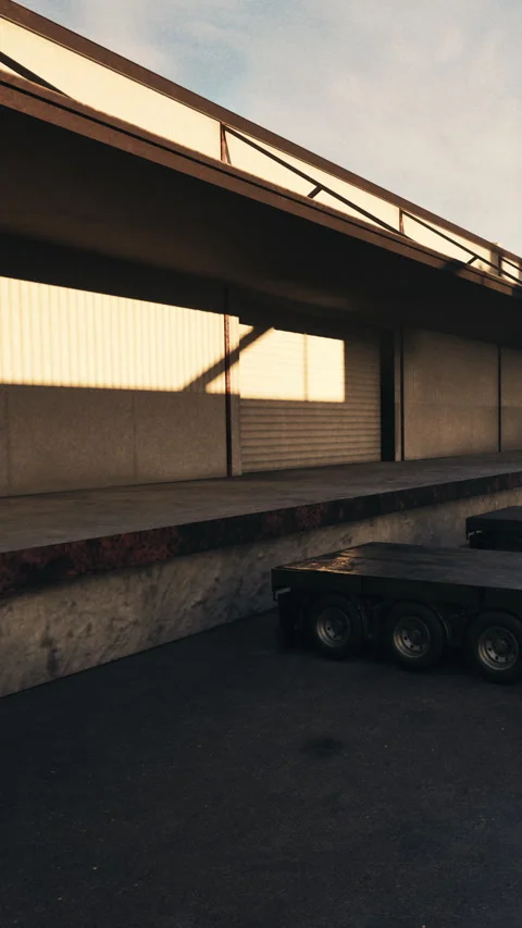 Delivery area with loading dock and empty trailer during evening time Stock Footage 340646837