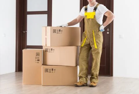 Delivery backdrop. Worker man in uniform at work. Stock Photos