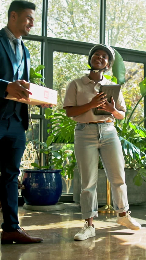 Delivery, box or man signing with tablet in building for courier service, online Stock Footage 340452656