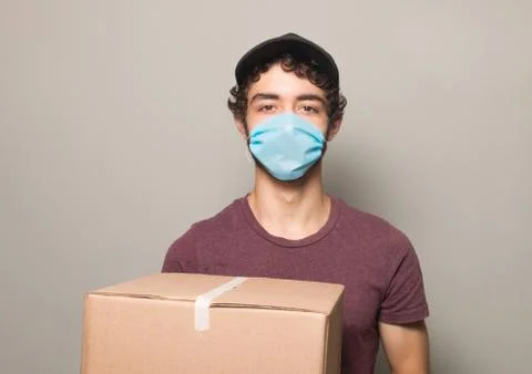 Delivery boy mask vertical Stock Photos