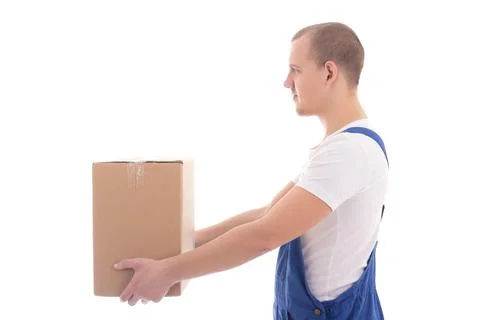 Delivery concept - side view of man in workwear giving cardboard box isolated 스톡 사진