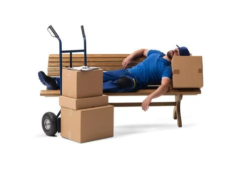 A delivery courier lying on a bench, sleeping with a hand cart of parcels. Stock Photos