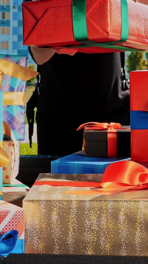 Delivery. donation, charity. gift boxes in car. close-up. woman unloads Stock Footage 318145936