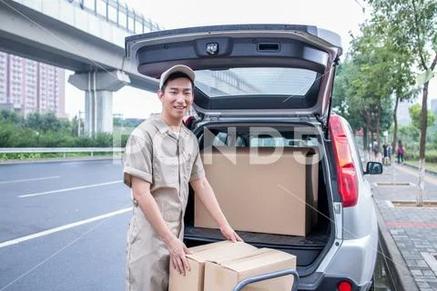 Delivery Driver Driving Van With Parcels