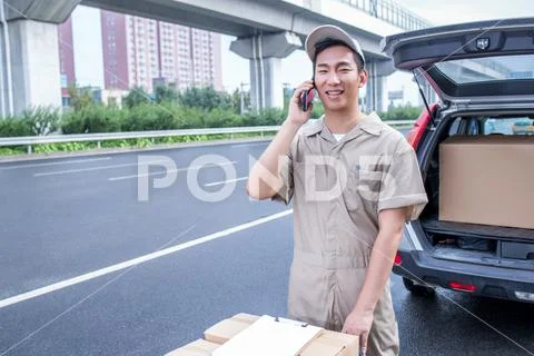 Delivery Driver Driving Van With Parcels