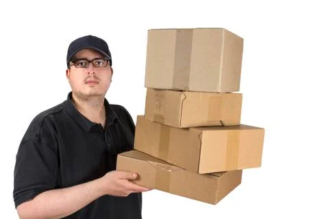Delivery driver with a stack of parcels Stock Photos