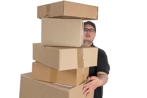 Delivery driver with a stack of parcels Stock Photos