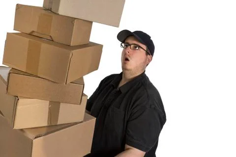 Delivery driver with a stack of parcels Stock Photos