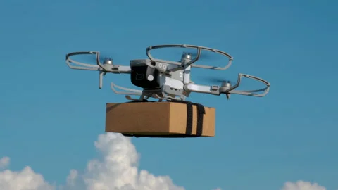 Delivery drone fly with package box on blue sky Stock Footage 164477990